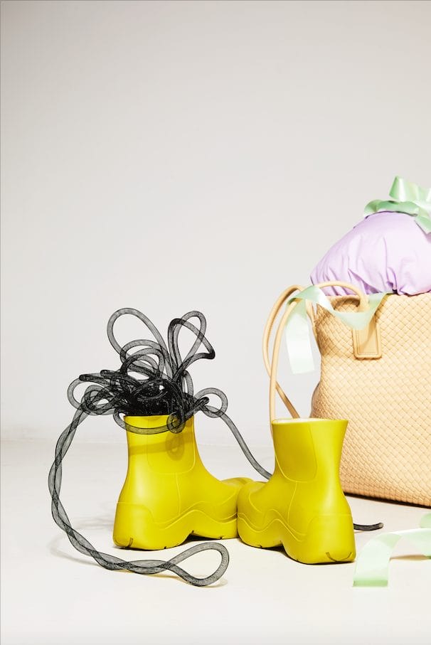 Artist Stephanie Jane Burt Turns Bottega Veneta's Accessories into Whimsical Sculptures The Puddle rubber ankle boots, Intrecciato leather tote.